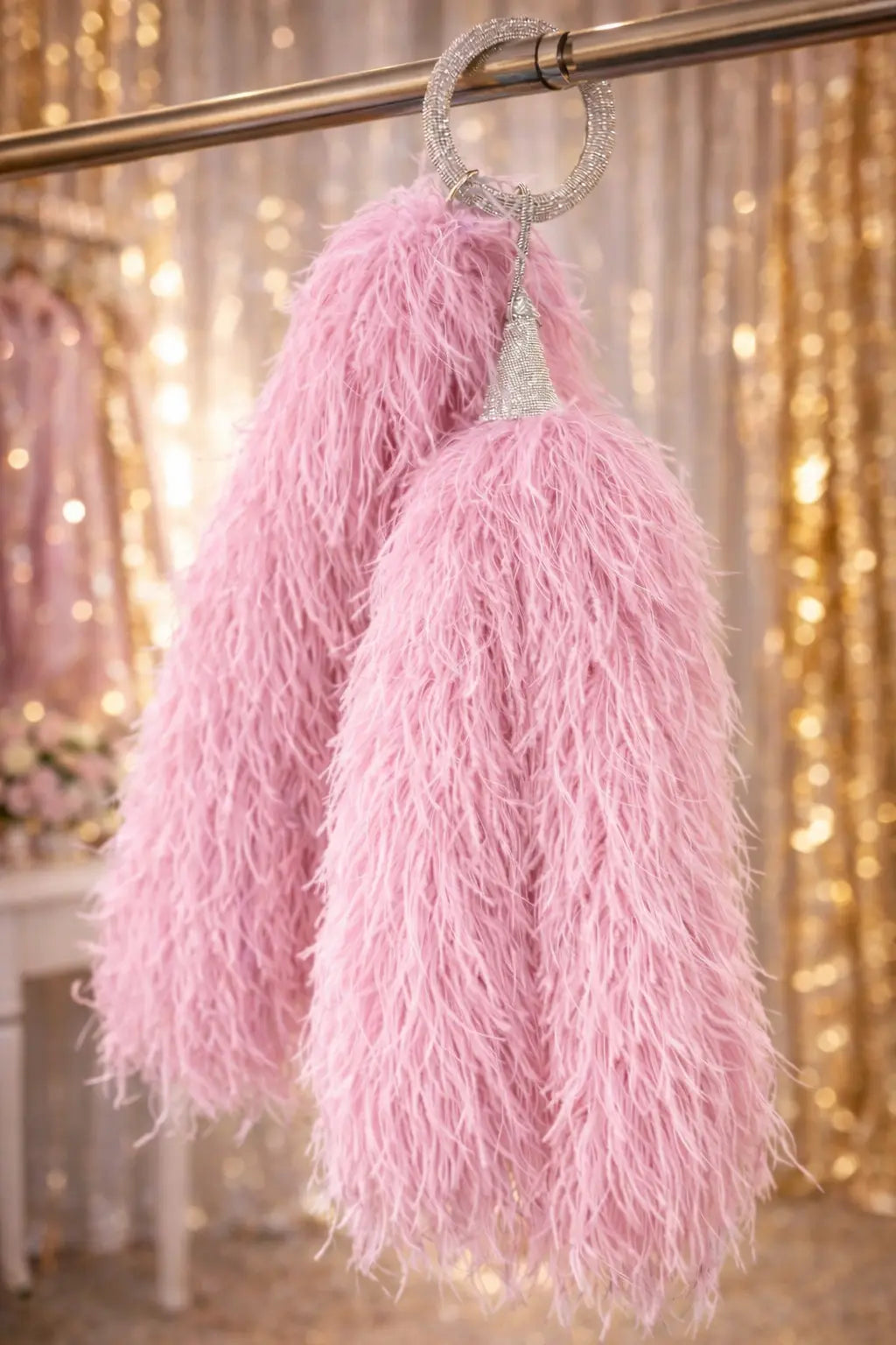 Interchangeable lower feather elements designed for movement and tail flow in stage performance